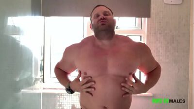 Big dick muscled stud Jay Muscle / Huge And Hung flexes wearing sneakers, shows his feet and cums a huge thick load jerking off in the shower.