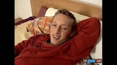 Blond twink Veso shows off his feet while beating his meat