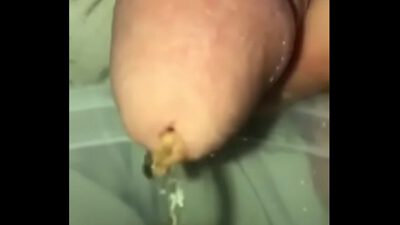Close up piss in a cup