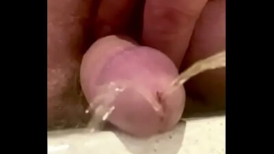 Extreme close up small Dick piss