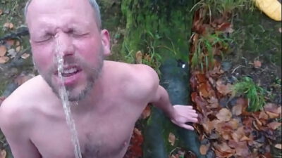 faggot drinks piss in the woods